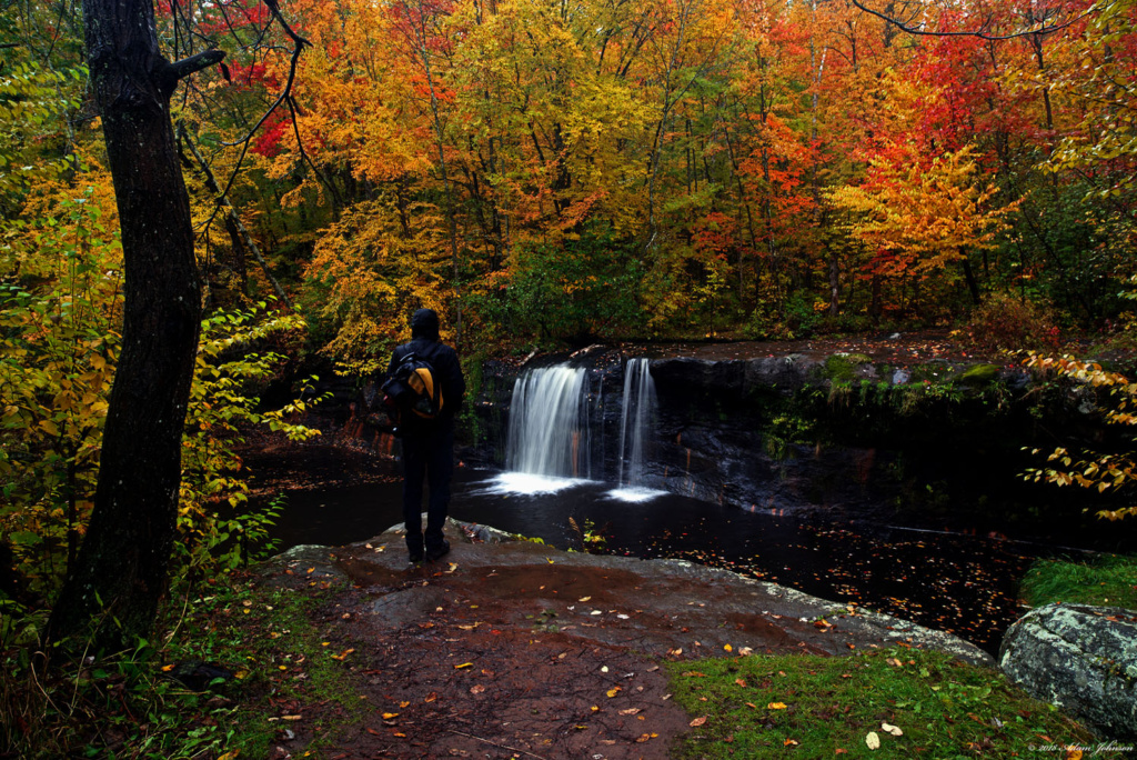 Standing on the ledge overlooking Wolf Creek Falls - Banning State Park