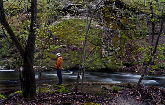 "Exploring the River Valley" Man standing on rocks of Minneopa Creek in the Minneopa Valley | Minneopa State Park