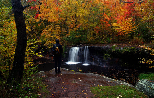 Standing on the ledge overlooking Wolf Creek Falls - Banning State Park