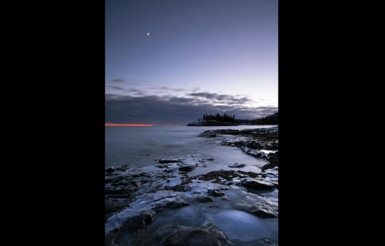 Ellingson Island and a crescent moon over Lake Superior | Split Rock Lighthouse State Park