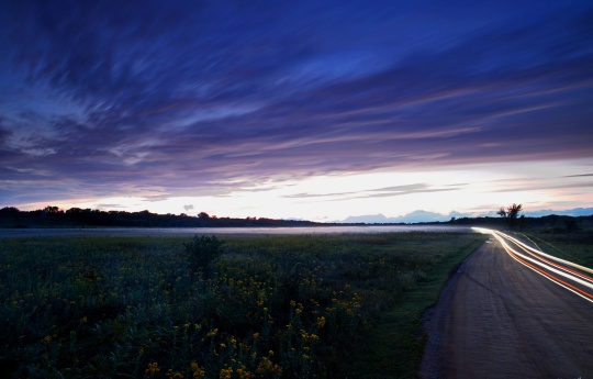 "Passing By" Minneopa State Park - Someone coming and someone leaving the bison range after sunset - Minneopa State Park