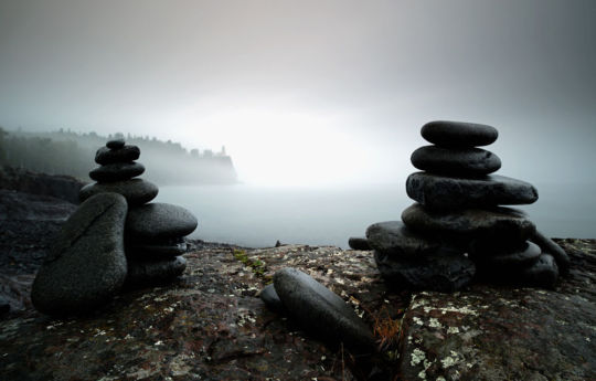 Stacked rocks and Split Rock Lighthouse through the fog | Split Rock Lighthouse State Park