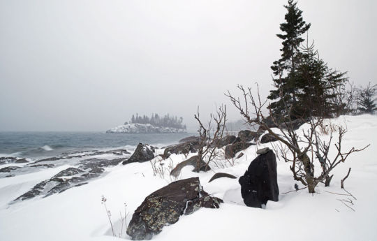 Wind and blowing snow on the rocky shoreline at Split Rock Lighthouse State Park