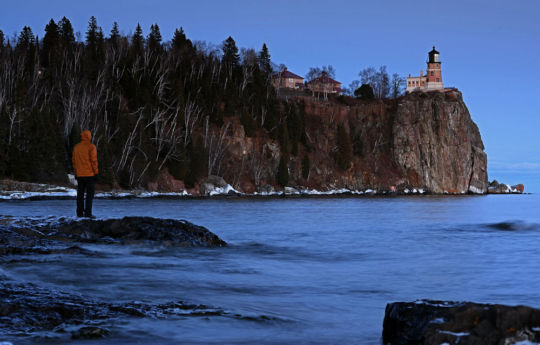 Standing on the Icy Shores of Superior with Split Rock Lighthouse in the background | Split Rock Lighthouse State Park