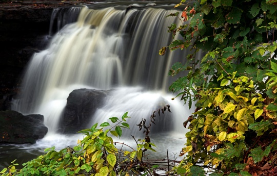 "Upper Minneopa Falls Framed By Leaves" Upper Minneopa Falls and leaves changing color as fall approaches - Minneopa State Park