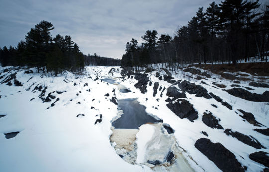 The view up stream from the swinging bridge in winter | Jay Cooke State Park