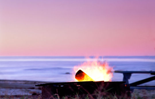 Campfire on the beach at Zippel Bay State Park